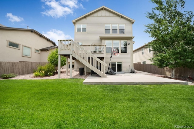 9135 Argentine Pass Trl, Colorado Springs, CO 80924 - back of property with a wooden deck, stairs, a patio, and a fenced backyard