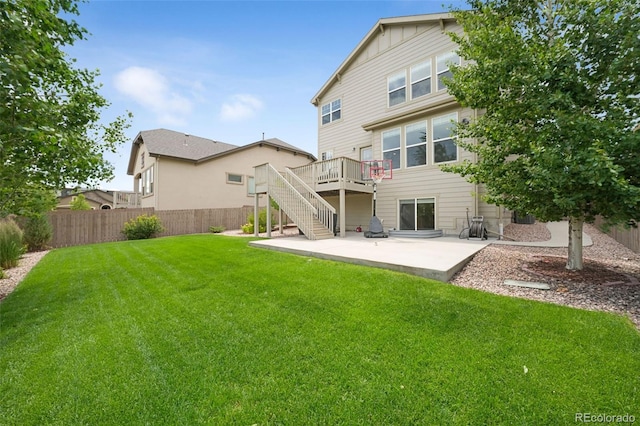 9135 Argentine Pass Trl, Colorado Springs, CO 80924 - rear view of property featuring a patio, stairway, and a wooden deck