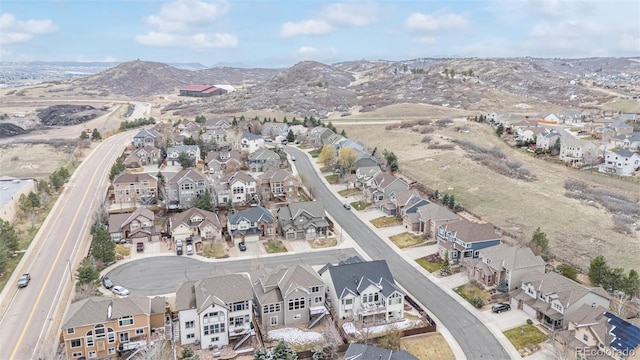 birds eye view of property with a mountain view and a residential view