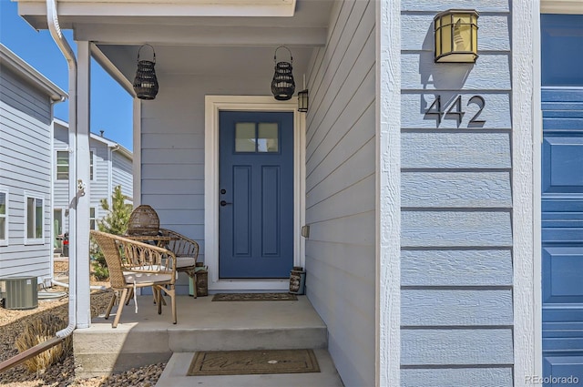 442 Stardust Ct, Dacono, CO 80514 - property entrance featuring central AC unit and a porch