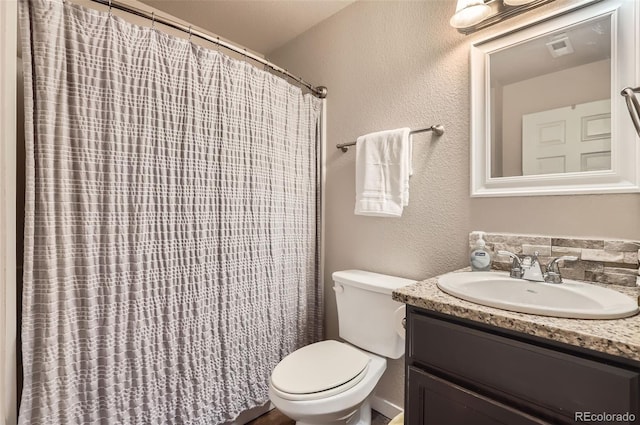 442 Stardust Ct, Dacono, CO 80514 - bathroom featuring visible vents, a shower with curtain, toilet, a textured wall, and vanity
