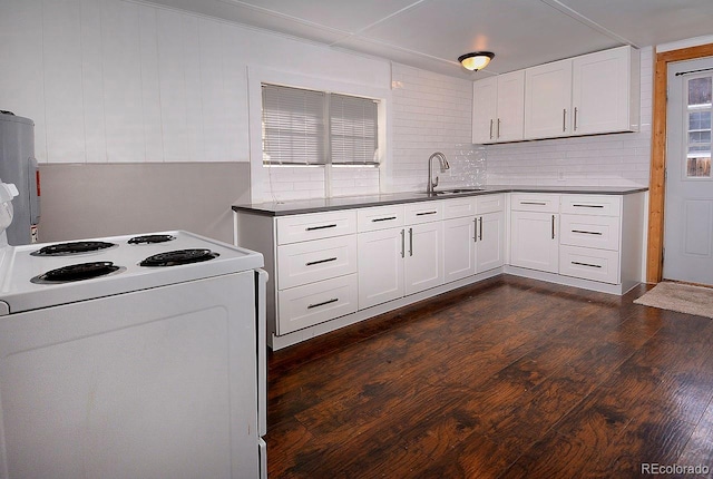 kitchen featuring decorative backsplash, dark hardwood / wood-style flooring, white electric range oven, and white cabinets