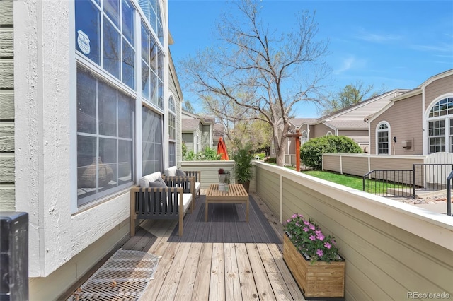 wooden deck featuring an outdoor hangout area