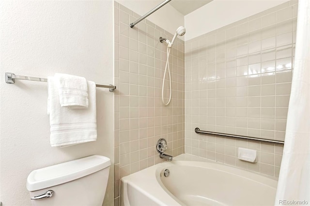 full bathroom featuring shower / bath combo with shower curtain and toilet