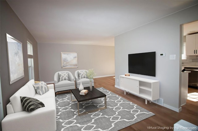 living area with baseboards and wood finished floors