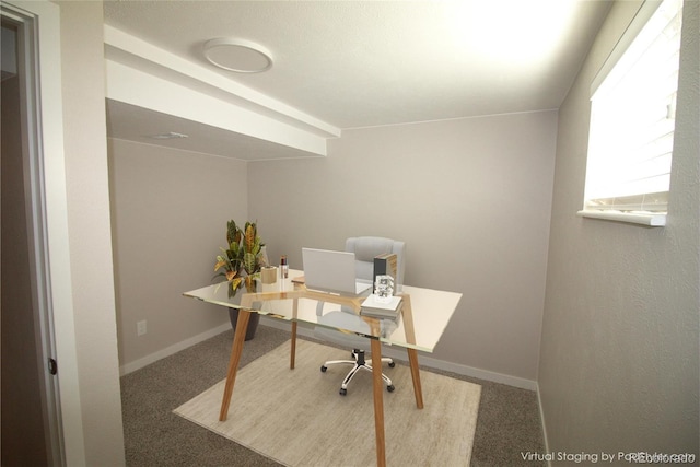 carpeted home office featuring baseboards