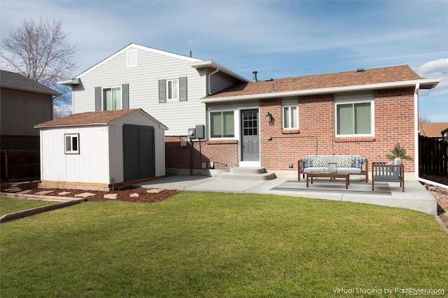 back of house with a storage shed, brick siding, an outdoor structure, a yard, and a patio area