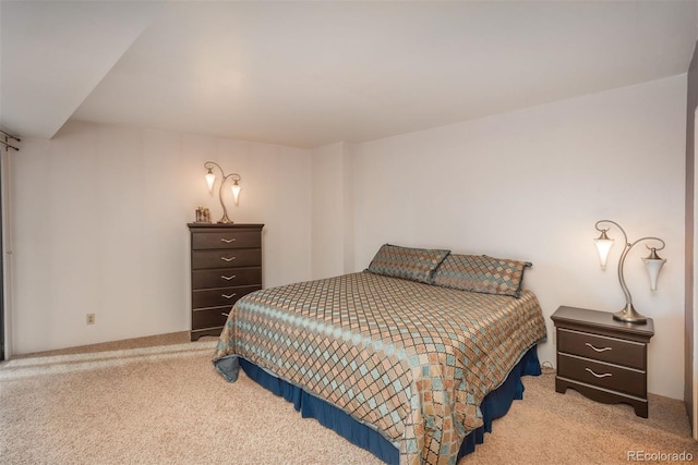 bedroom featuring light colored carpet