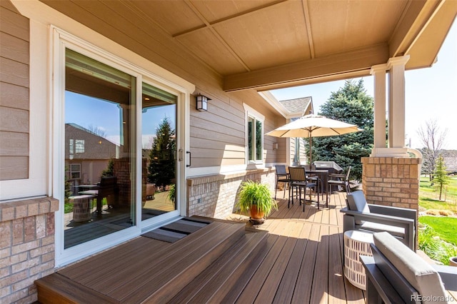 wooden deck with outdoor dining space