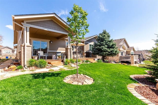 exterior space featuring a yard and a wooden deck