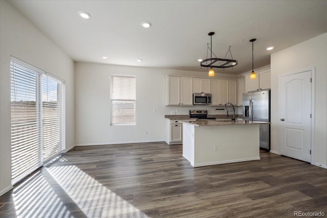 kitchen with a sink, dark wood-style floors, white cabinetry, recessed lighting, and stainless steel appliances