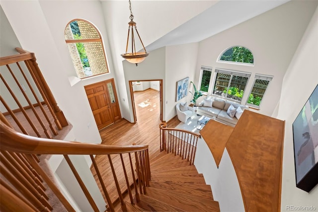 7313 Poston Way, Boulder, CO 80301 - entryway with high vaulted ceiling, healthy amount of natural light, wood finished floors, and stairway