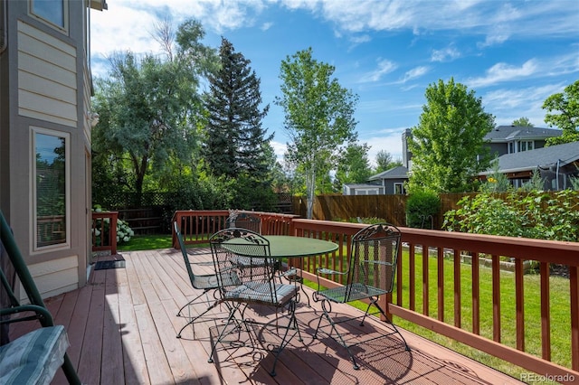 7313 Poston Way, Boulder, CO 80301 - wooden deck featuring a fenced backyard and outdoor dining area
