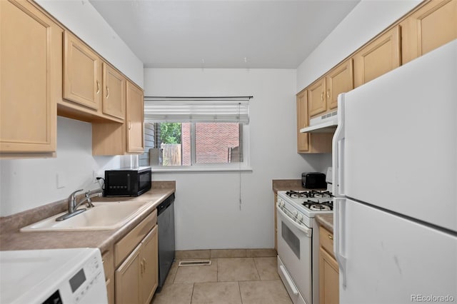 kitchen with white appliances, light countertops, light brown cabinetry, under cabinet range hood, and a sink