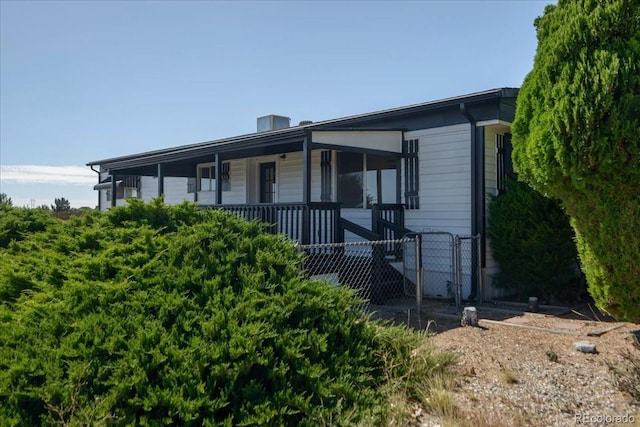 view of side of home with a porch