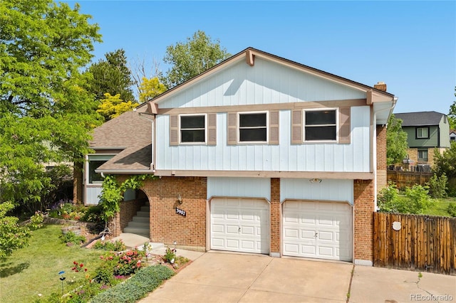 3907 E 133rd Ct, Thornton, CO 80241 - view of front of property with a garage, concrete driveway, a shingled roof, and brick siding