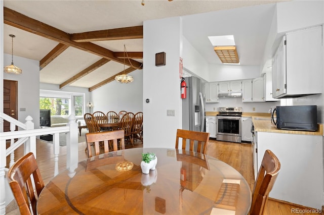 3907 E 133rd Ct, Thornton, CO 80241 - dining space with light wood finished floors and a chandelier