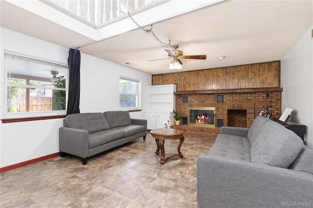 3907 E 133rd Ct, Thornton, CO 80241 - living room with baseboards, a ceiling fan, and a fireplace