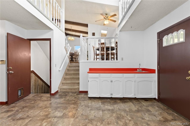 3907 E 133rd Ct, Thornton, CO 80241 - foyer entrance with ceiling fan, baseboards, stairway, and stone finish flooring
