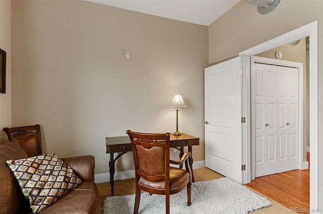 office area with light wood-style flooring and baseboards