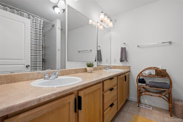 9300 E Florida Ave Unit 1202, Denver, CO 80247 - bathroom with double vanity, tile patterned flooring, and a shower