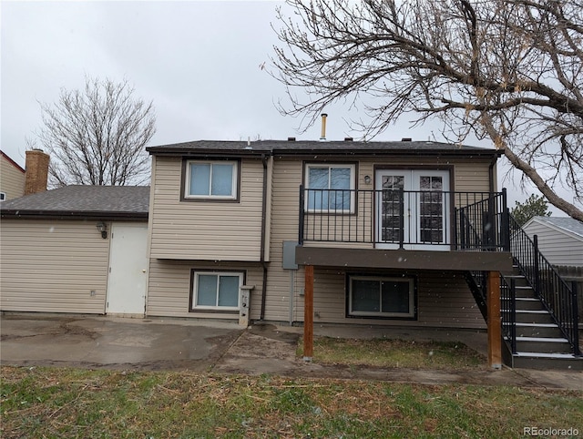 220 Mckinley Dr, Bennett, CO 80102 - rear view of house with stairway and a patio area