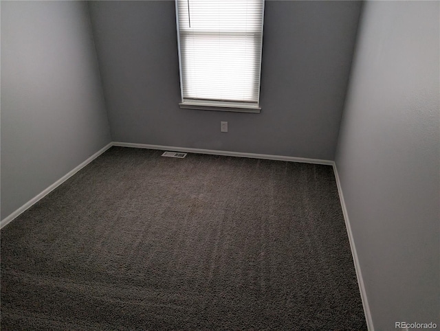 220 Mckinley Dr, Bennett, CO 80102 - unfurnished room with visible vents, carpet flooring, and baseboards
