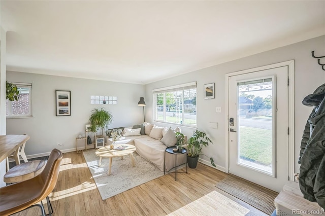 living room with wood finished floors and baseboards