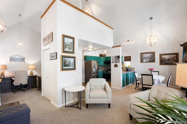 carpeted living room featuring a chandelier and high vaulted ceiling