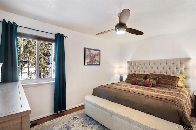 bedroom featuring ceiling fan and hardwood / wood-style flooring