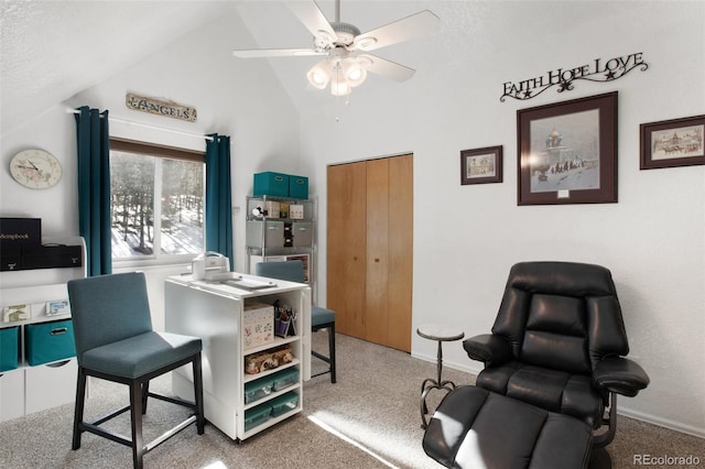 carpeted office space with ceiling fan, high vaulted ceiling, and a textured ceiling