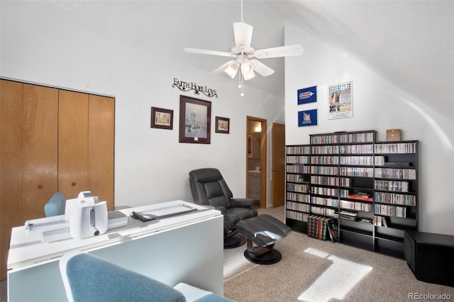 carpeted office featuring ceiling fan and high vaulted ceiling