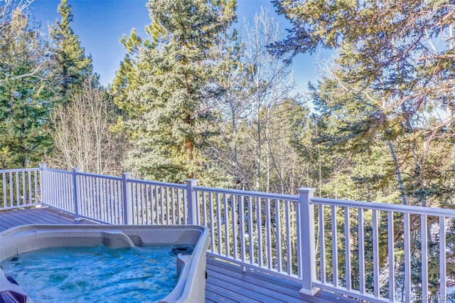 deck featuring a hot tub