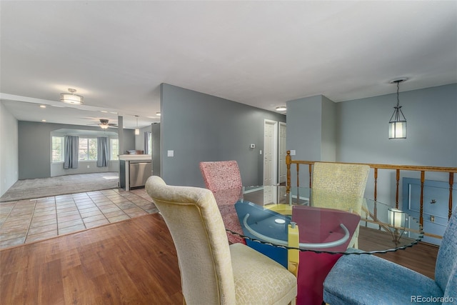 dining room with light wood-type flooring and ceiling fan