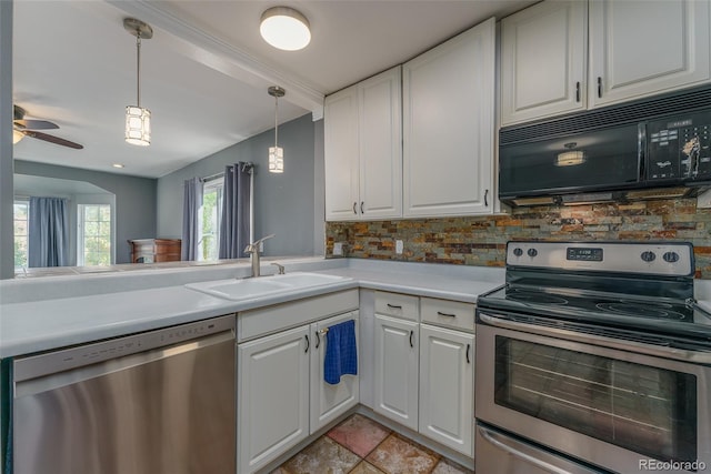 kitchen featuring white cabinets, appliances with stainless steel finishes, sink, and decorative backsplash