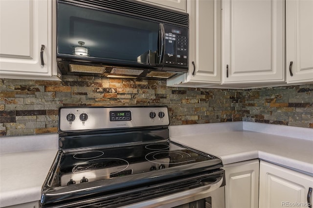 kitchen featuring white cabinetry, stainless steel range with electric cooktop, and tasteful backsplash