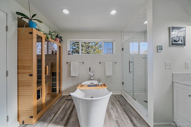 34 Skyline Dr, Wheat Ridge, CO 80215 - full bath featuring a freestanding tub, wood finished floors, a stall shower, baseboards, and recessed lighting