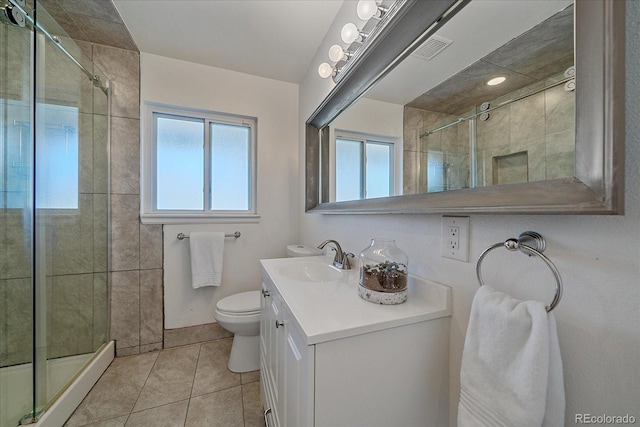 34 Skyline Dr, Wheat Ridge, CO 80215 - full bathroom with plenty of natural light, toilet, tile patterned floors, and vanity