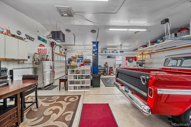 34 Skyline Dr, Wheat Ridge, CO 80215 - garage featuring a workshop area and a heating unit