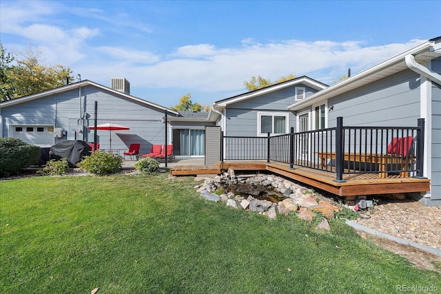 34 Skyline Dr, Wheat Ridge, CO 80215 - back of property featuring a yard, a deck, and central AC