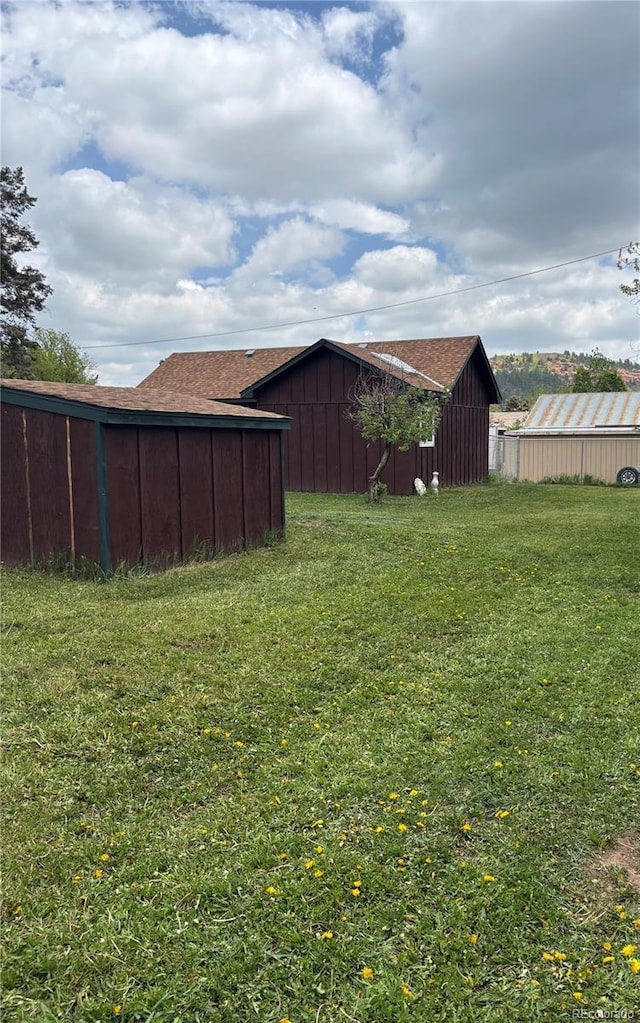 245 Lower Glenway St, Palmer Lake, CO 80133 - view of grassy yard with a pole building and an outbuilding