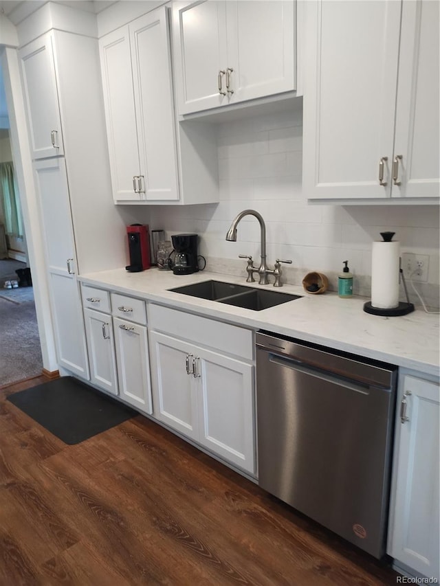 245 Lower Glenway St, Palmer Lake, CO 80133 - kitchen with dishwasher, dark wood-style floors, white cabinets, and decorative backsplash