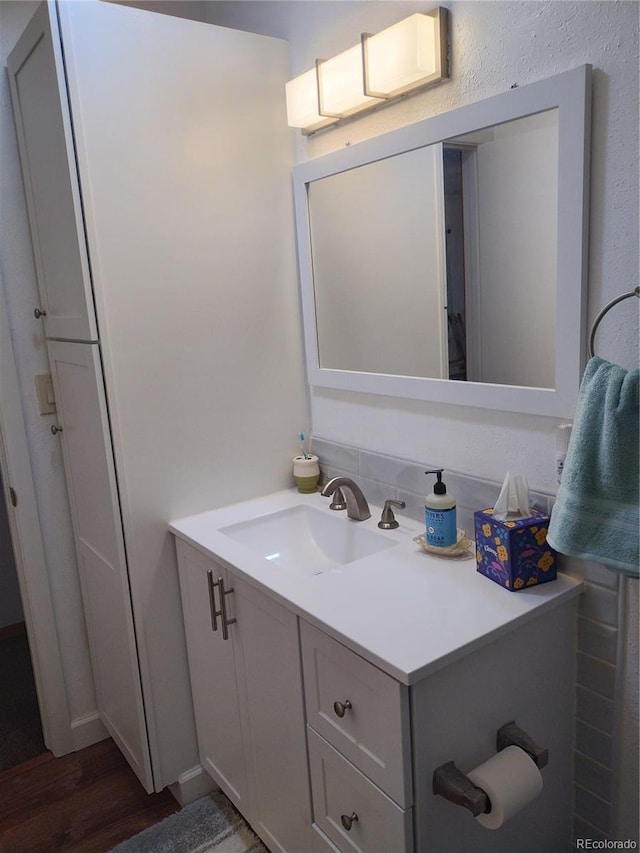 245 Lower Glenway St, Palmer Lake, CO 80133 - bathroom with vanity and wood finished floors