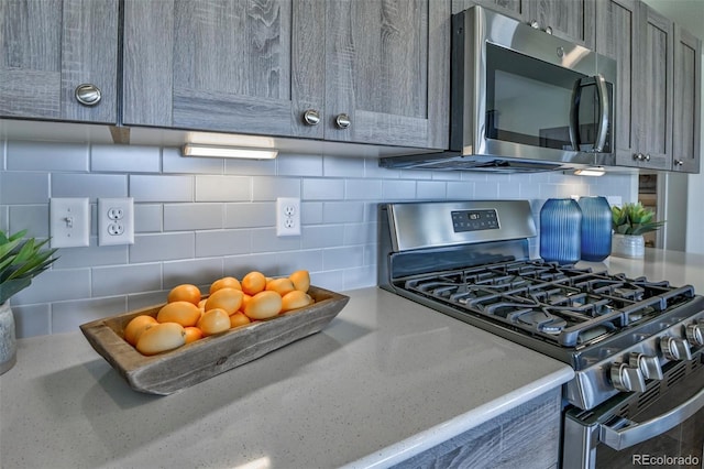 834 N Bently St, Watkins, CO 80137 - kitchen view of stainless steel appliances and tasteful backsplash