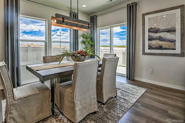 834 N Bently St, Watkins, CO 80137 - dining area with dark wood finished floors, recessed lighting, and baseboards