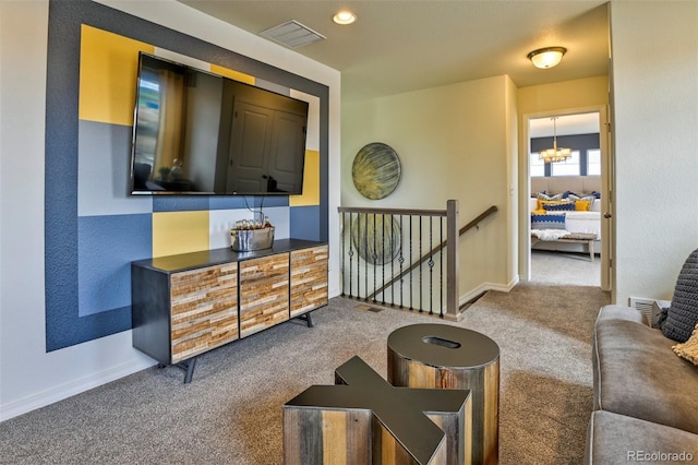 834 N Bently St, Watkins, CO 80137 - carpeted living area featuring baseboards and a chandelier