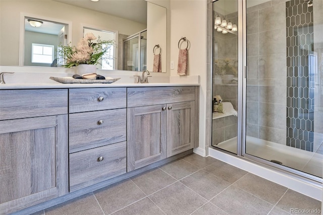 834 N Bently St, Watkins, CO 80137 - full bathroom featuring double vanity, tile patterned floors, and a stall shower
