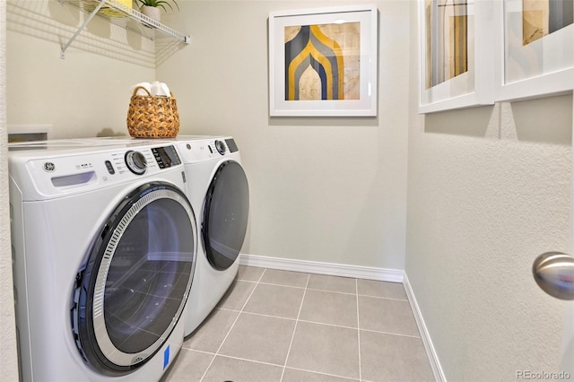 834 N Bently St, Watkins, CO 80137 - laundry area with baseboards, washer and clothes dryer, and tile patterned flooring