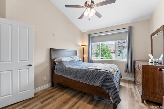 8779 S Kipling Way Unit 204, Littleton, CO 80127 - bedroom with vaulted ceiling, light wood-style floors, baseboards, and a ceiling fan