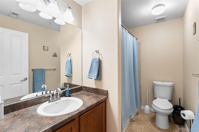 8779 S Kipling Way Unit 204, Littleton, CO 80127 - full bathroom featuring vanity, toilet, tile patterned floors, and a shower with shower curtain